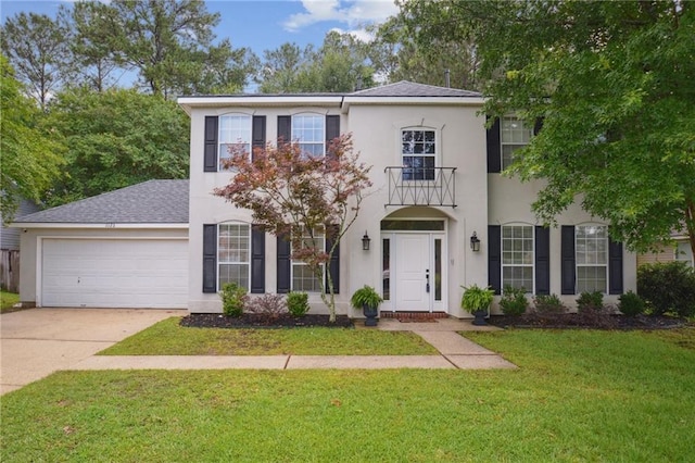 1125 Lori Dr, Slidell, LA 70461 - view of front of home with an attached garage, stucco siding, driveway, a front lawn, and a balcony