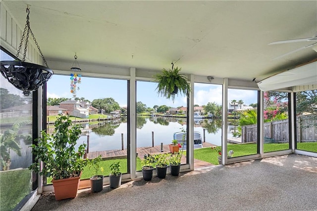 425 Eden Isles Blvd, Slidell, LA 70458 - unfurnished sunroom with a water view, ceiling fan, and a residential view