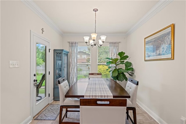 42059 Wood Ave, Ponchatoula, LA 70454 - dining space with healthy amount of natural light, ornamental molding, and a chandelier