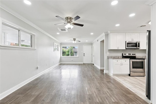 1614 River Oaks Dr, New Orleans, LA 70131 - kitchen featuring stainless steel appliances, a ceiling fan, white cabinets, ornamental molding, and recessed lighting