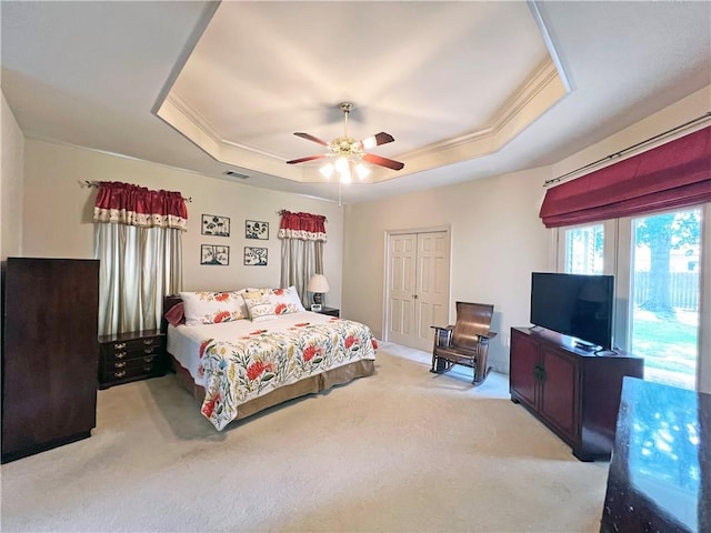 207 Hidden Springs Ln, Covington, LA 70433 - bedroom with a raised ceiling, light colored carpet, and ceiling fan