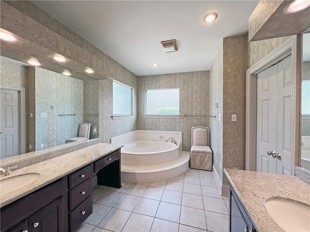 207 Hidden Springs Ln, Covington, LA 70433 - full bath with two vanities, a garden tub, and tile patterned flooring