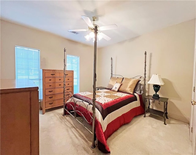 207 Hidden Springs Ln, Covington, LA 70433 - bedroom with light colored carpet and a ceiling fan