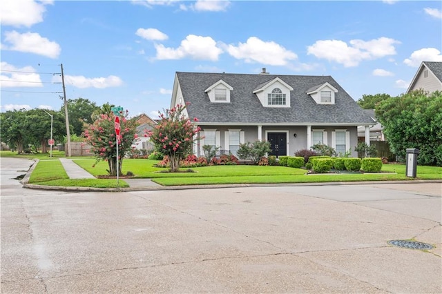 1 Platt St, Kenner, LA 70065 - cape cod-style house with a front lawn, roof with shingles, and stucco siding