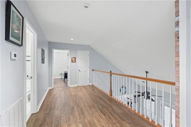 1 Platt St, Kenner, LA 70065 - hallway with wood finished floors, vaulted ceiling, and recessed lighting
