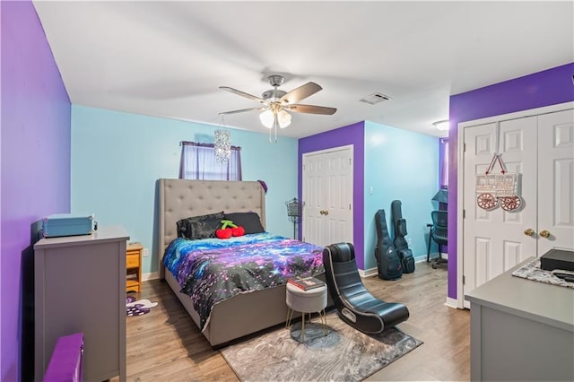 1 Platt St, Kenner, LA 70065 - bedroom featuring two closets, light wood finished floors, and ceiling fan