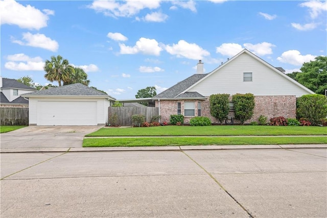 1 Platt St, Kenner, LA 70065 - view of front of house featuring a chimney, brick siding, and a garage