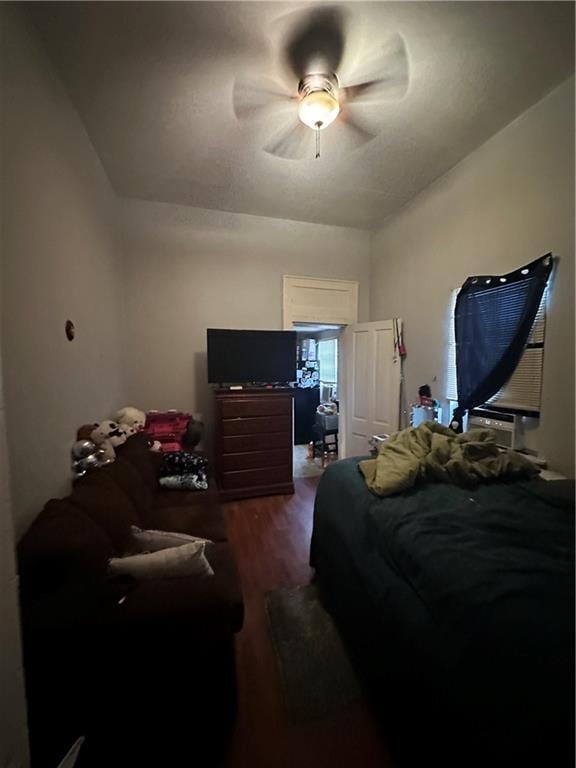 2620-22 Philip St, New Orleans, LA 70113 - bedroom featuring wood finished floors, cooling unit, and a ceiling fan
