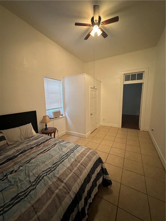 2620-22 Philip St, New Orleans, LA 70113 - bedroom featuring light tile patterned floors, cooling unit, and ceiling fan