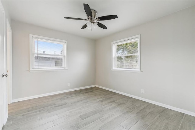 2128 Dupont Dr, Gretna, LA 70056 - unfurnished room with healthy amount of natural light, light wood finished floors, and ceiling fan