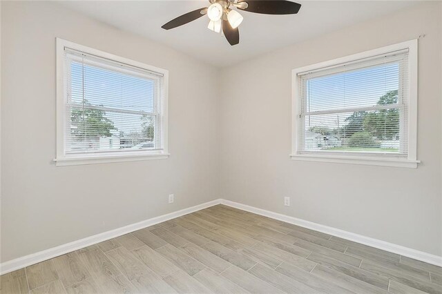 2128 Dupont Dr, Gretna, LA 70056 - empty room featuring light wood-type flooring and a ceiling fan