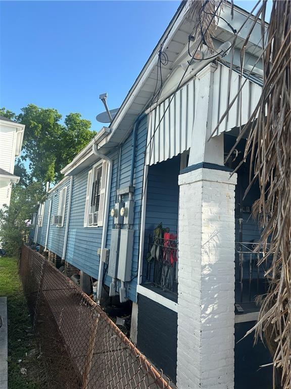 2217 Willow St, New Orleans, LA 70113 - view of home's exterior with cooling unit