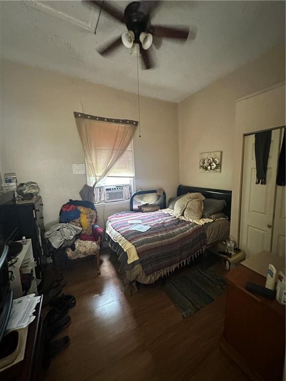 2217 Willow St, New Orleans, LA 70113 - bedroom with wood finished floors, cooling unit, and ceiling fan