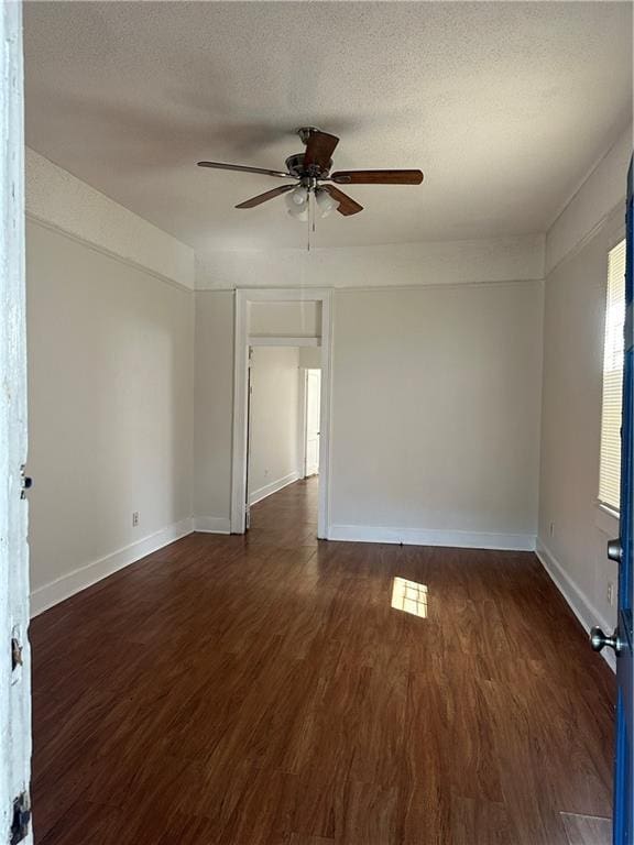 2217 Willow St, New Orleans, LA 70113 - spare room featuring ceiling fan, wood finished floors, and a textured ceiling