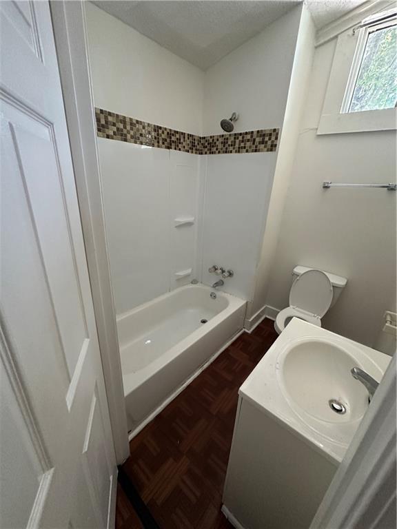 2217 Willow St, New Orleans, LA 70113 - full bath featuring shower / bathtub combination, vanity, and a textured ceiling