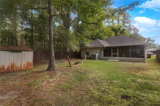 2523 Robin St, Slidell, LA 70460 - view of yard with a sunroom and a storage unit