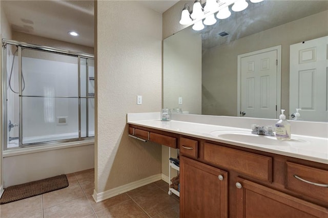 2523 Robin St, Slidell, LA 70460 - bathroom with shower / bath combination with glass door, vanity, a textured wall, tile patterned flooring, and a chandelier