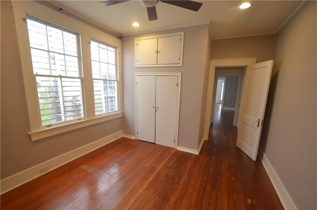 4005-4007 Camp St, New Orleans, LA 70115 - unfurnished bedroom featuring ornamental molding, dark wood-style floors, recessed lighting, a ceiling fan, and a closet