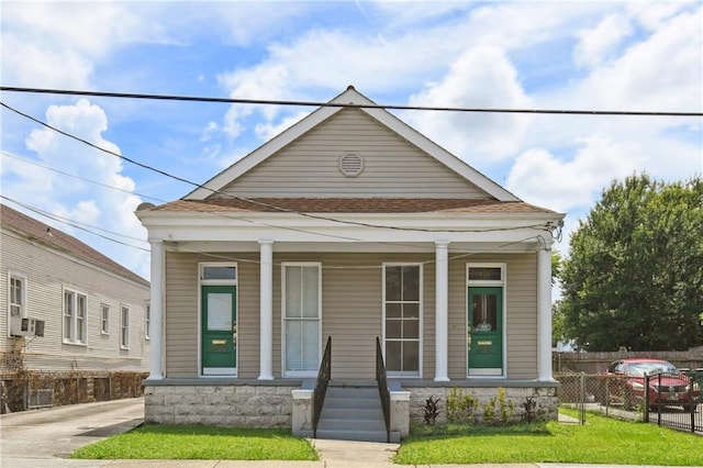 922 Lafayette St, Gretna, LA 70053 - shotgun-style home featuring covered porch and cooling unit