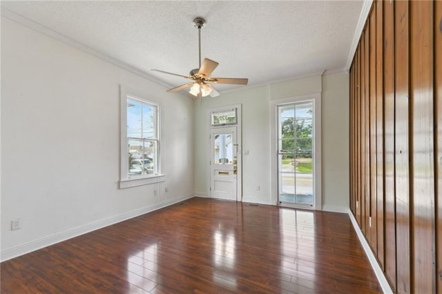 922 Lafayette St, Gretna, LA 70053 - empty room featuring plenty of natural light, a ceiling fan, ornamental molding, a textured ceiling, and wood finished floors