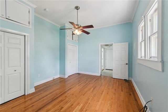 922 Lafayette St, Gretna, LA 70053 - unfurnished bedroom with crown molding, light wood finished floors, and ceiling fan