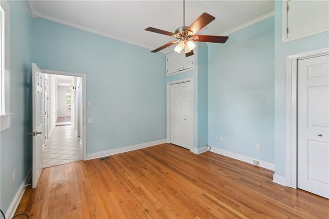 922 Lafayette St, Gretna, LA 70053 - unfurnished bedroom featuring ornamental molding, light wood-style flooring, ceiling fan, and vaulted ceiling