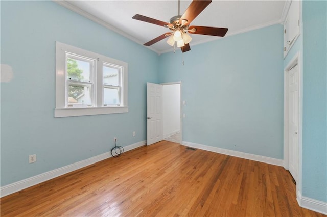 922 Lafayette St, Gretna, LA 70053 - unfurnished bedroom with crown molding, light wood-style flooring, and a ceiling fan