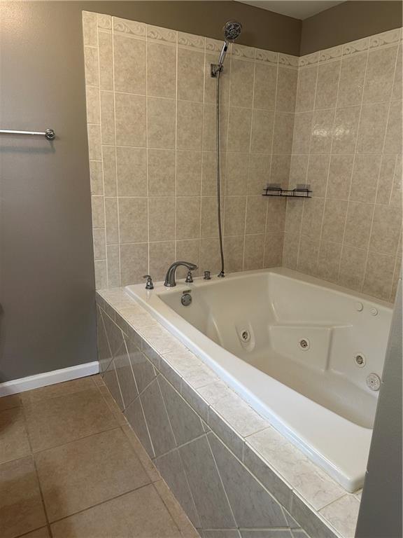 808 Pine Tree St, Slidell, LA 70458 - full bath featuring tile patterned flooring and a combined bath / shower with jetted tub