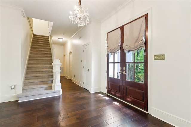 104 Acadian Ln, Mandeville, LA 70471 - entryway featuring stairway, hardwood / wood-style floors, a chandelier, crown molding, and french doors
