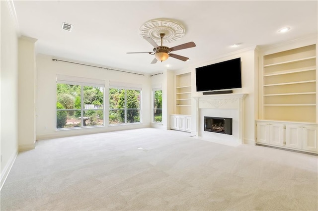 104 Acadian Ln, Mandeville, LA 70471 - unfurnished living room featuring carpet, ceiling fan, built in shelves, a fireplace with flush hearth, and recessed lighting