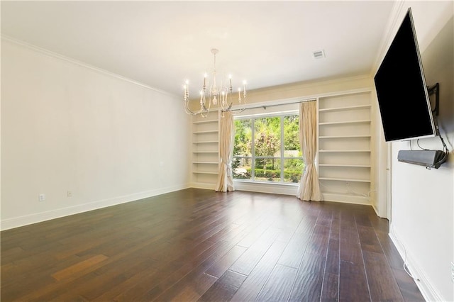 104 Acadian Ln, Mandeville, LA 70471 - unfurnished living room featuring a chandelier, built in features, ornamental molding, and dark wood-style flooring