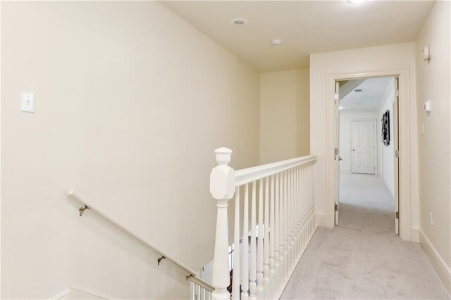 104 Acadian Ln, Mandeville, LA 70471 - corridor featuring an upstairs landing and carpet flooring