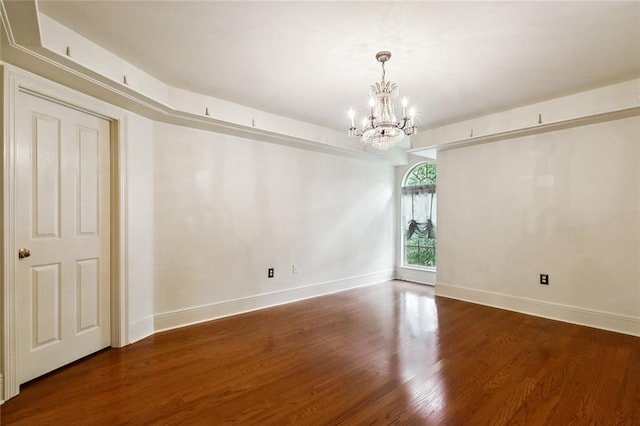 104 Acadian Ln, Mandeville, LA 70471 - spare room with a chandelier and wood finished floors