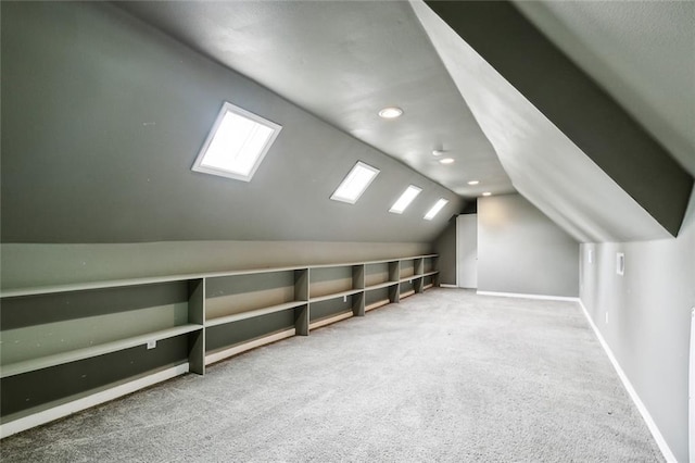 104 Acadian Ln, Mandeville, LA 70471 - bonus room featuring carpet floors, vaulted ceiling, recessed lighting, and a skylight