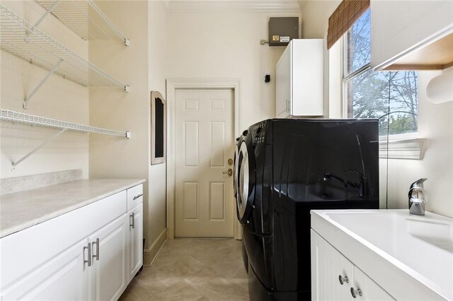 104 Acadian Ln, Mandeville, LA 70471 - laundry area featuring cabinet space and ornamental molding