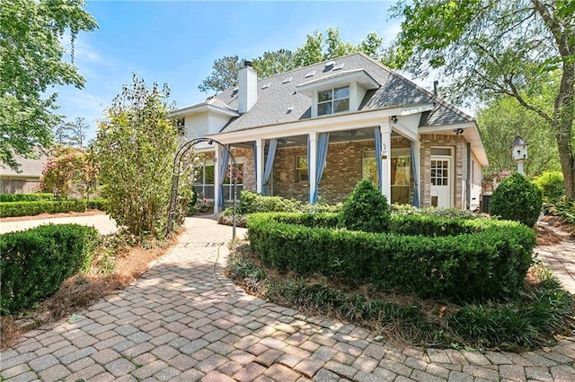 104 Acadian Ln, Mandeville, LA 70471 - view of front of house with brick siding and a chimney