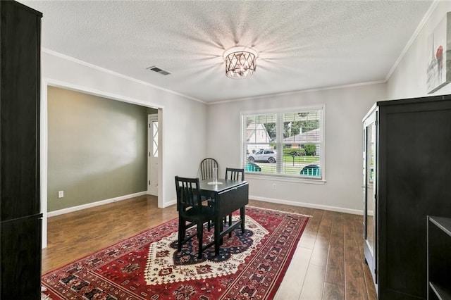 124 Brentwood Dr, Belle Chasse, LA 70037 - office space with dark wood finished floors, a textured ceiling, and crown molding