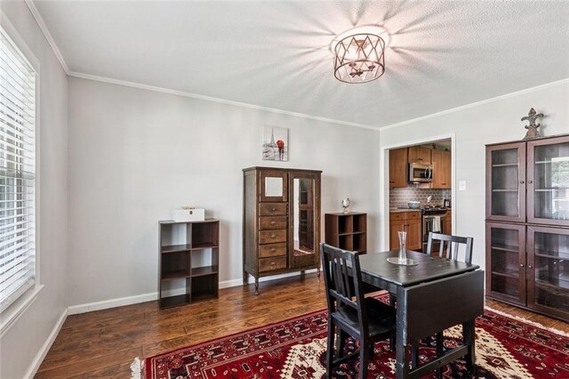 124 Brentwood Dr, Belle Chasse, LA 70037 - dining area with dark wood-style floors and crown molding