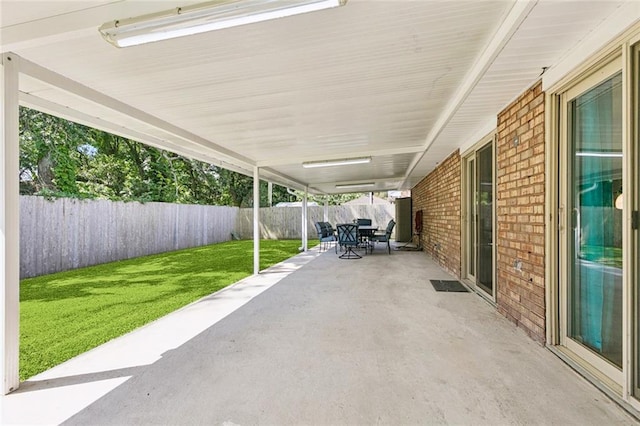 124 Brentwood Dr, Belle Chasse, LA 70037 - fenced backyard featuring a patio area and outdoor dining area