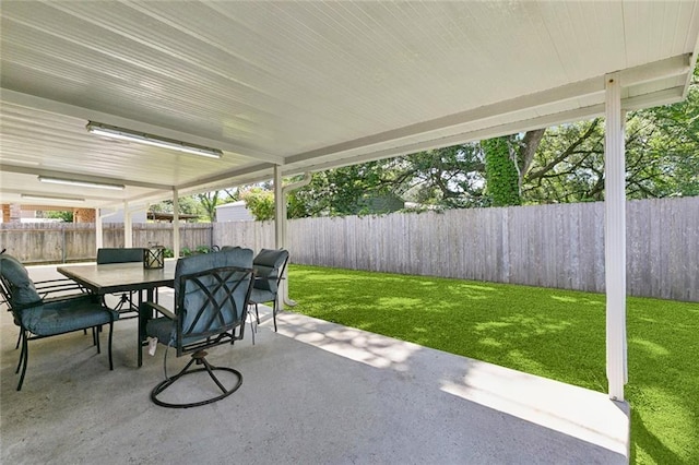 124 Brentwood Dr, Belle Chasse, LA 70037 - fenced backyard with a patio and outdoor dining area