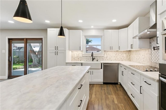 1424 Pecan Ave, Metairie, LA 70001 - kitchen with stainless steel dishwasher, wall chimney exhaust hood, black electric cooktop, dark wood finished floors, and white cabinets