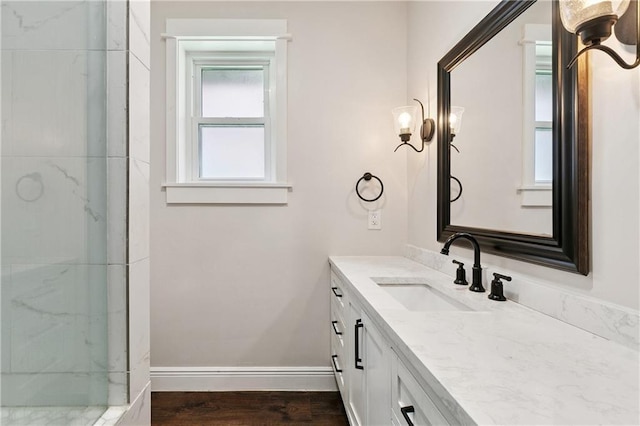 1424 Pecan Ave, Metairie, LA 70001 - bathroom with vanity, a marble finish shower, and wood finished floors
