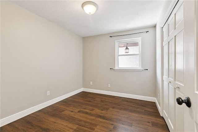 1424 Pecan Ave, Metairie, LA 70001 - unfurnished bedroom featuring a closet and dark wood-style floors