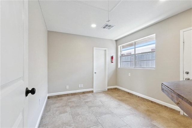 1424 Pecan Ave, Metairie, LA 70001 - spare room with attic access and baseboards