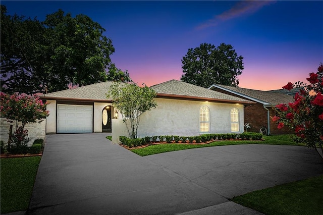 1424 Pecan Ave, Metairie, LA 70001 - single story home featuring driveway, an attached garage, and stucco siding