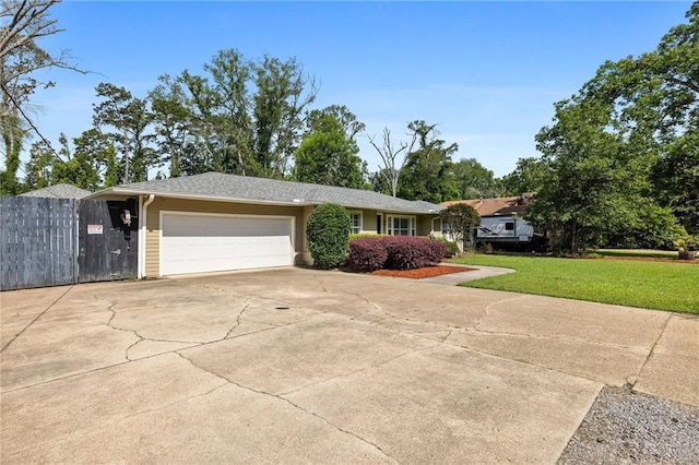 900 S Cypress St, Hammond, LA 70403 - ranch-style house with a garage and driveway