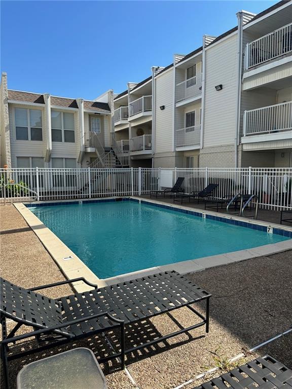 3805 Houma Blvd Unit A243, Metairie, LA 70006 - community pool with a residential view and a patio