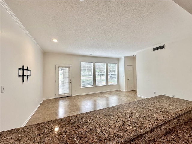 350 Emerald Forest Blvd Unit 5105, Covington, LA 70433 - tiled empty room featuring a textured ceiling, ornamental molding, and recessed lighting