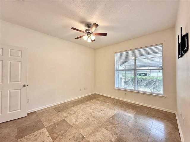 350 Emerald Forest Blvd Unit 5105, Covington, LA 70433 - spare room with ceiling fan, a textured ceiling, and stone finish flooring