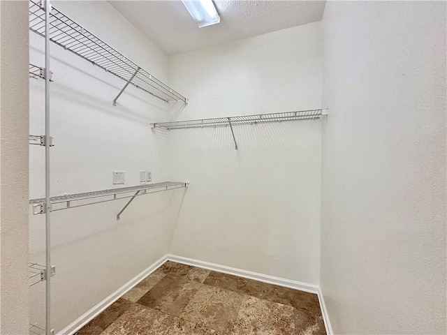 350 Emerald Forest Blvd Unit 5105, Covington, LA 70433 - walk in closet with stone finish flooring